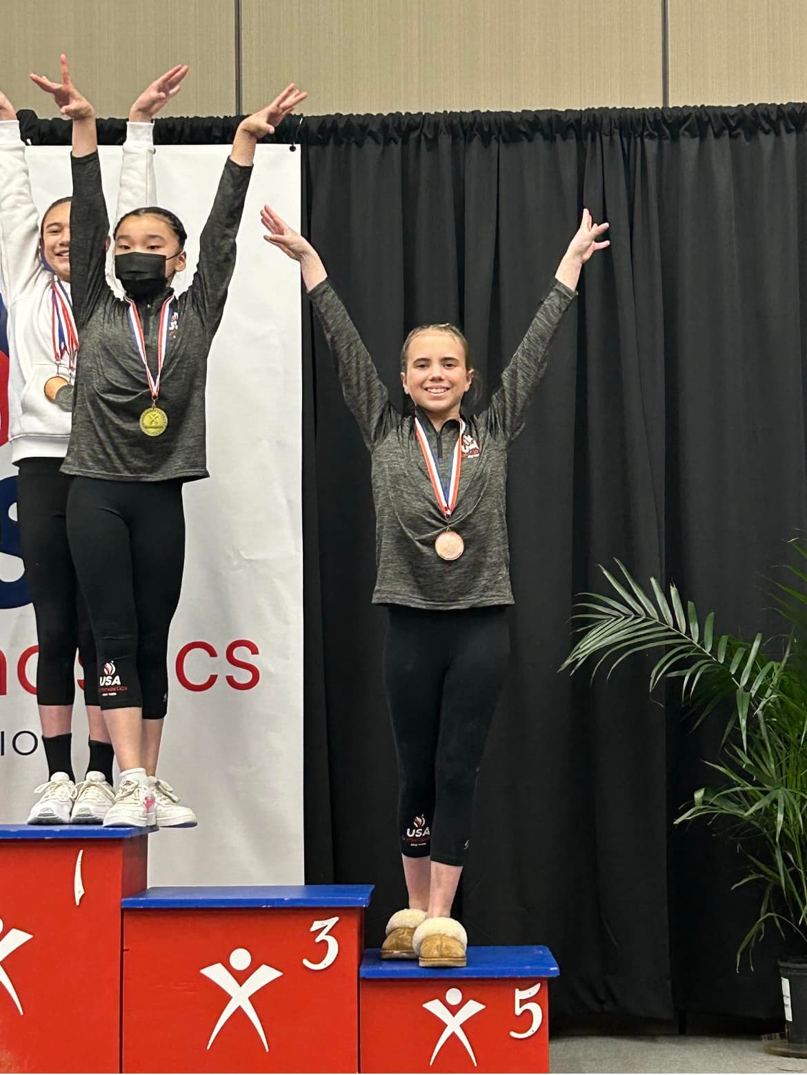 Gymnasts on podium